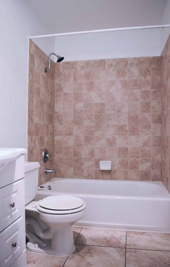 bathroom with beige tiles